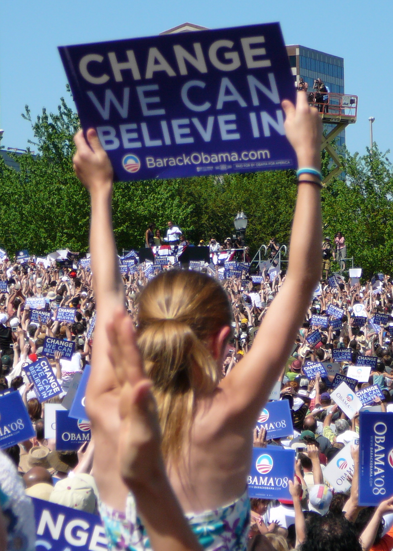 A woman holds a Change We Can Believe In sign at Barack Obama’s Portland rally in May 2008.